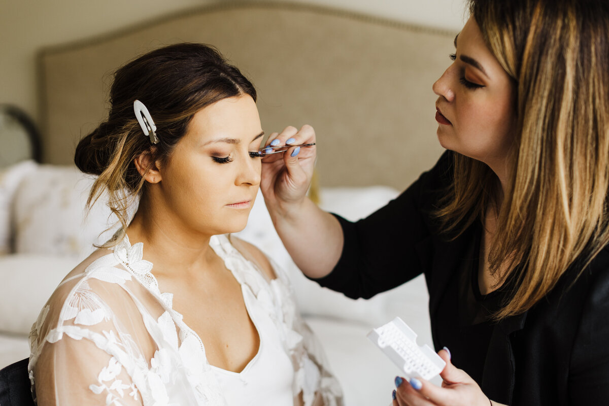 Bride getting her make up done