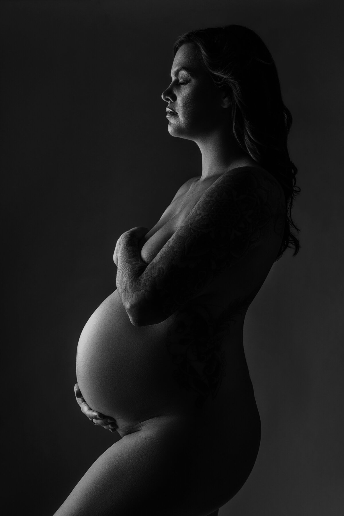 Maternity silhouette in nc photography studio