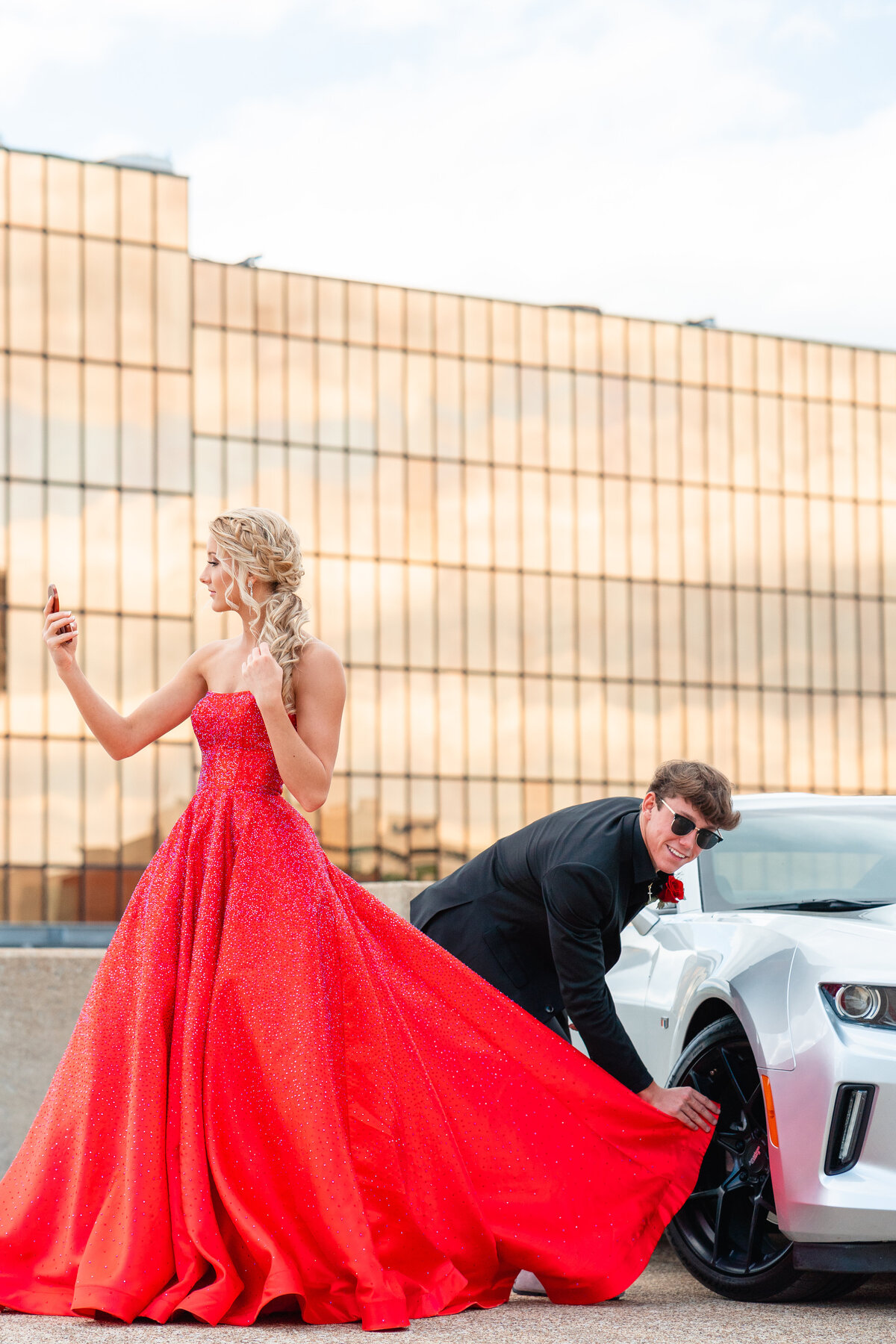 Chattanooga photographer Kelley Hoagland takes prom portraits at West Village Chattanooga, TN location.  Teenagers posed with car.