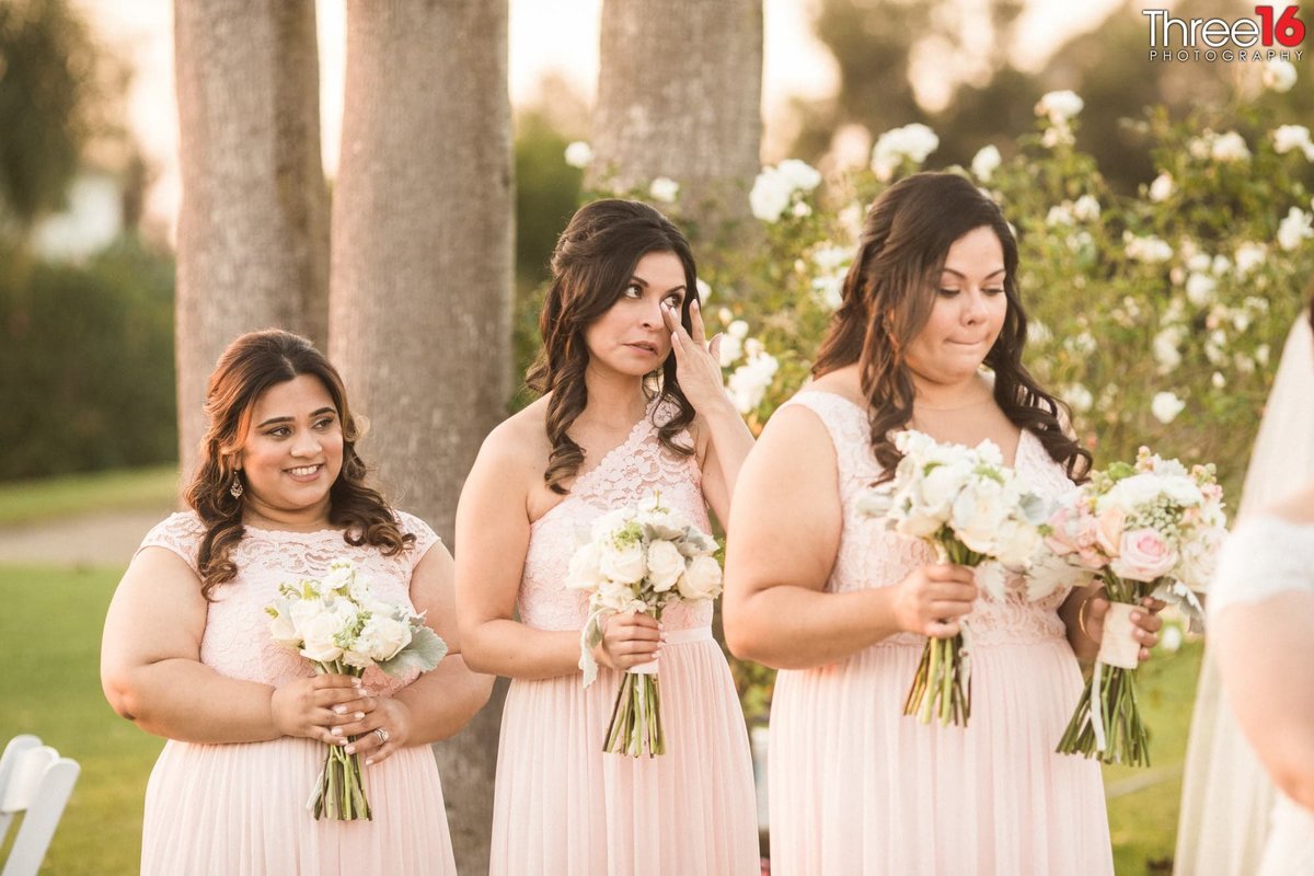 Smiles and Tears by the Bridesmaids during the ceremony