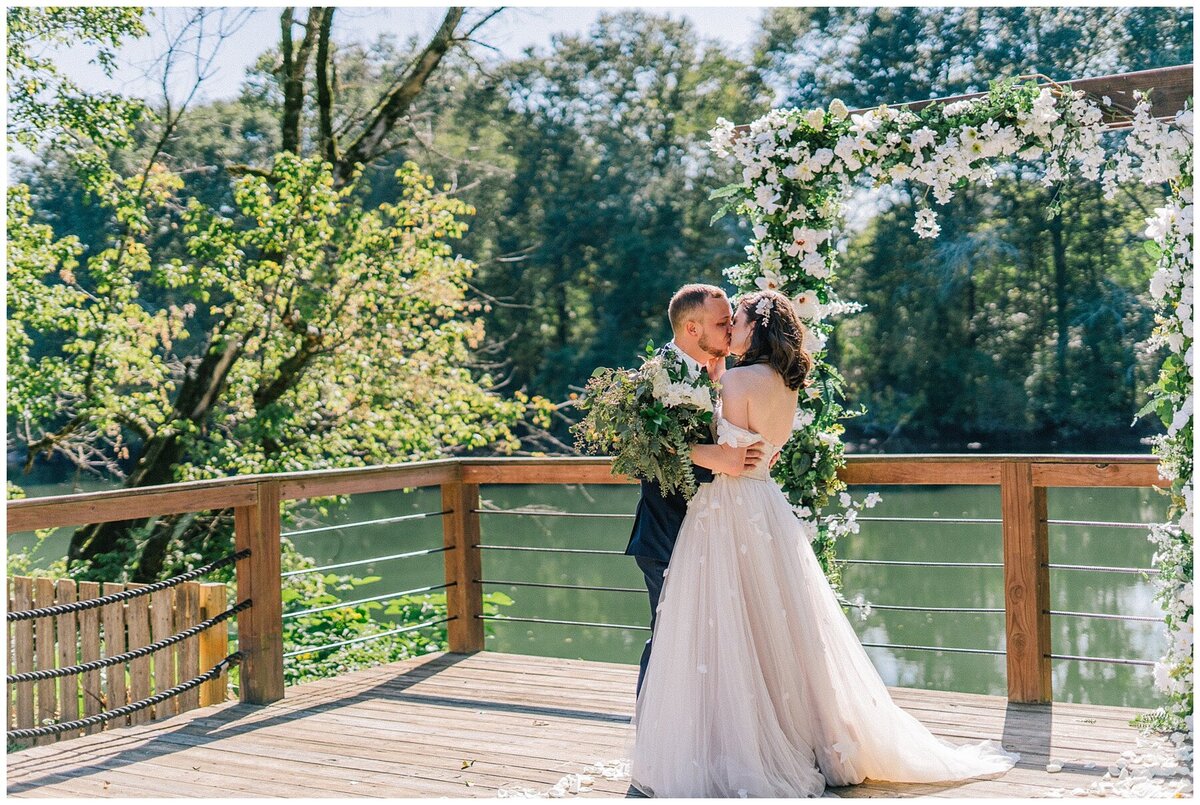 Sacramento Wedding Photographer captures couple kissing after wedding ceremony