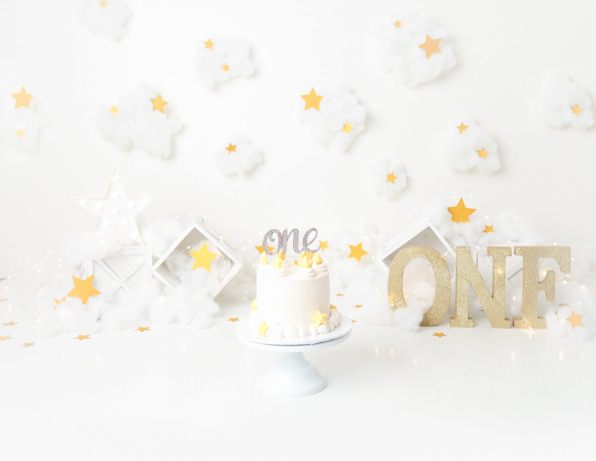 A cloud and stars themed cake smash in Rochester, NY.