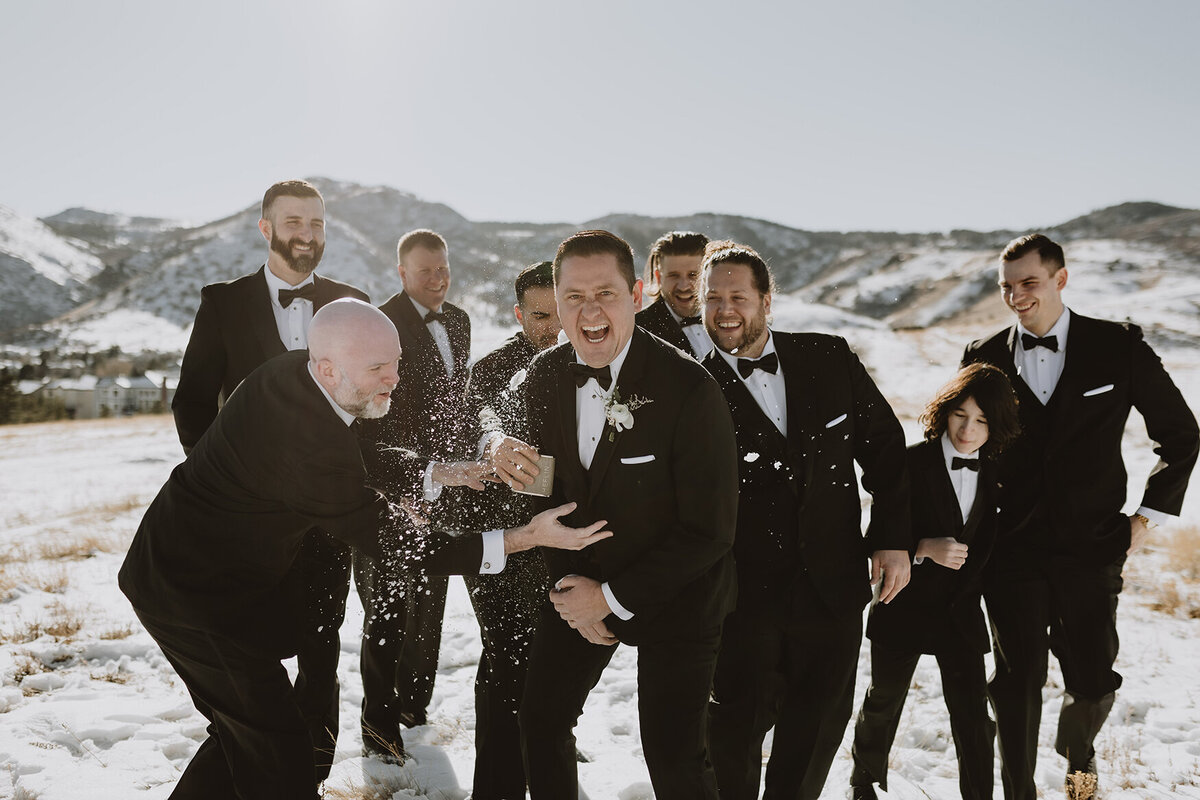 groomsmen throwing snowballs