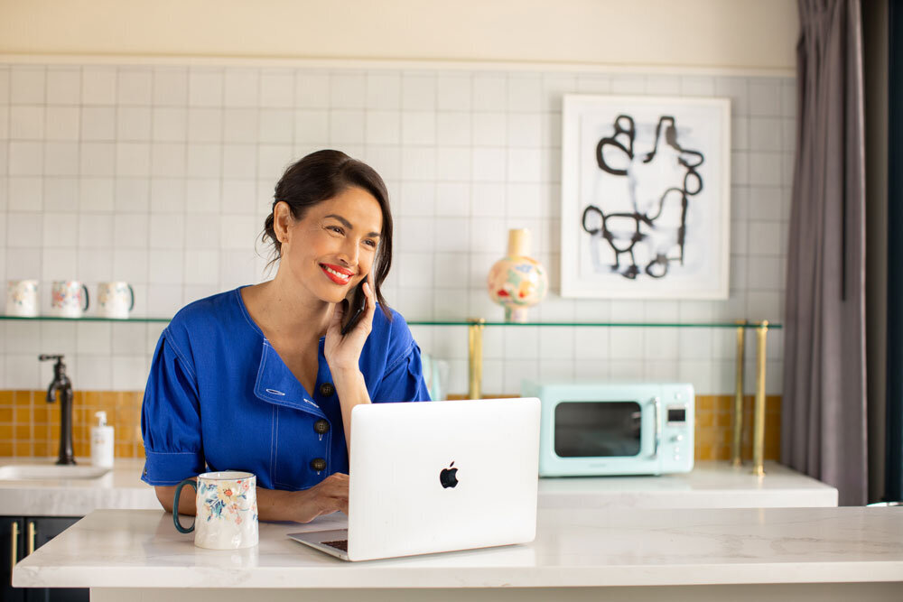 mailchimp older attractive woman working from home female CEO claremont hotel apple macbook air