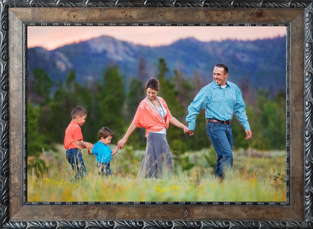 Family dressed in coral and turquoise with two little boys in the Happy Jack mountains.