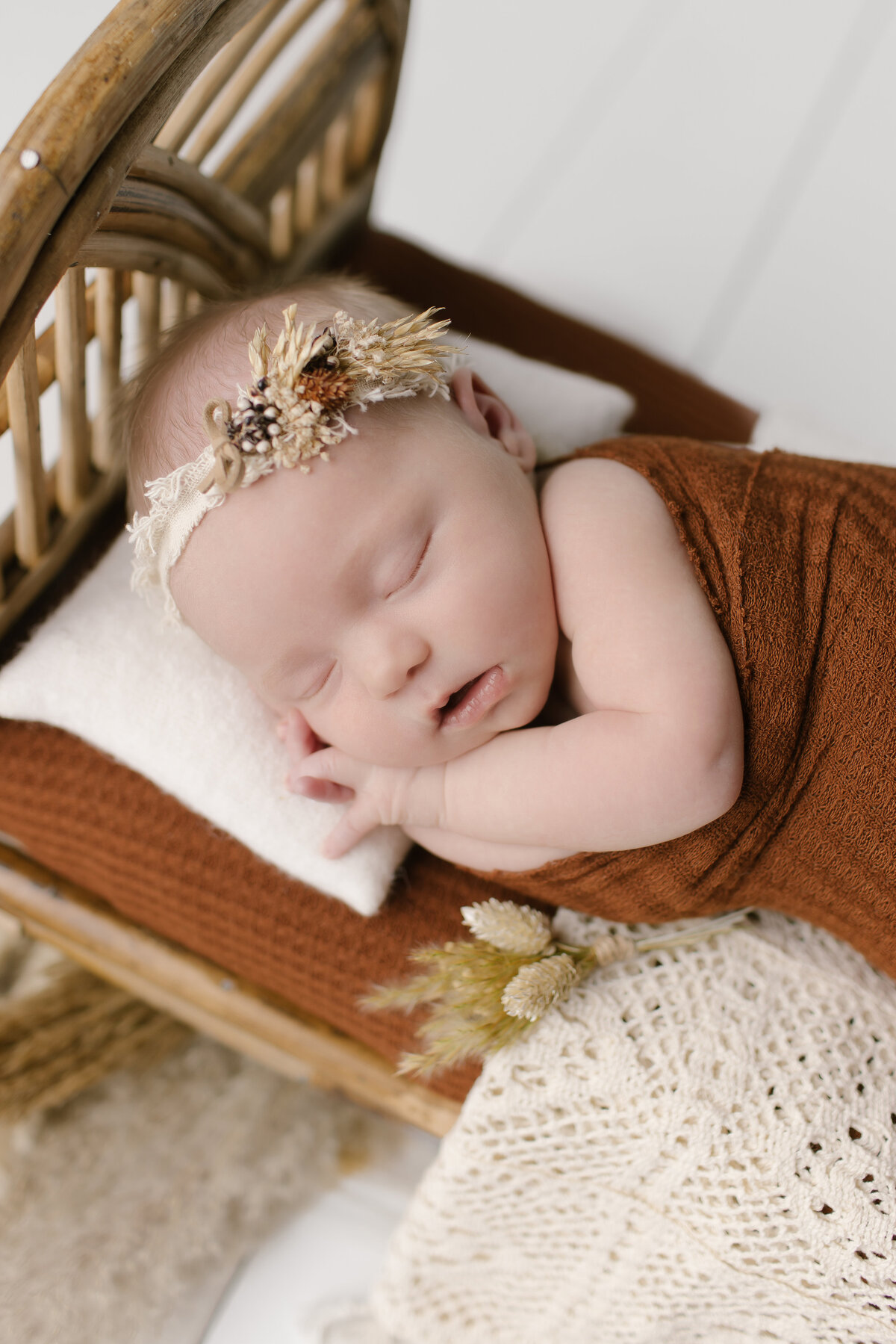 Newborn in baby bed
