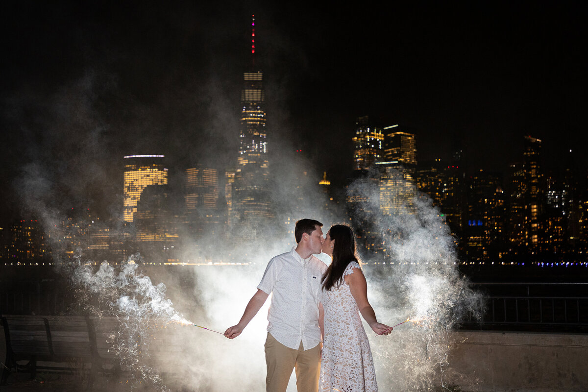 engagement-session-night-sparklers-kissing-nj
