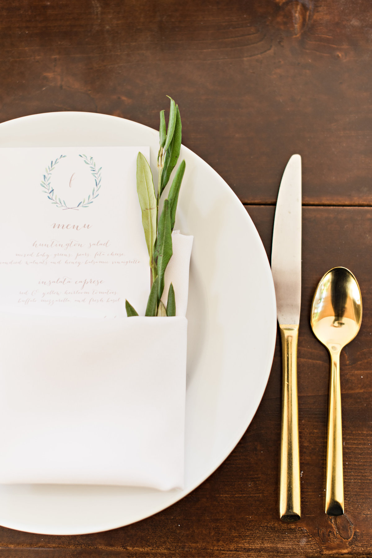 place setting at heritage farm wedding with rosemary