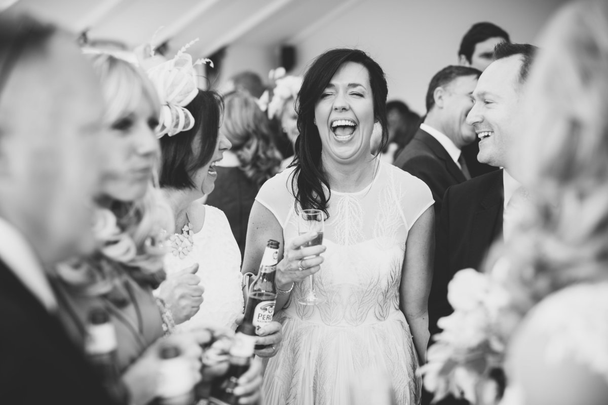 marquee wedding bridesmaid laughing