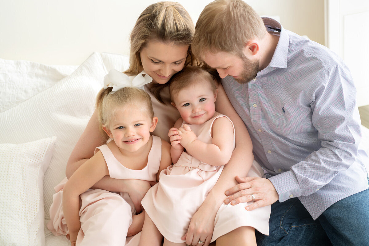 Family session of little girls and their parents