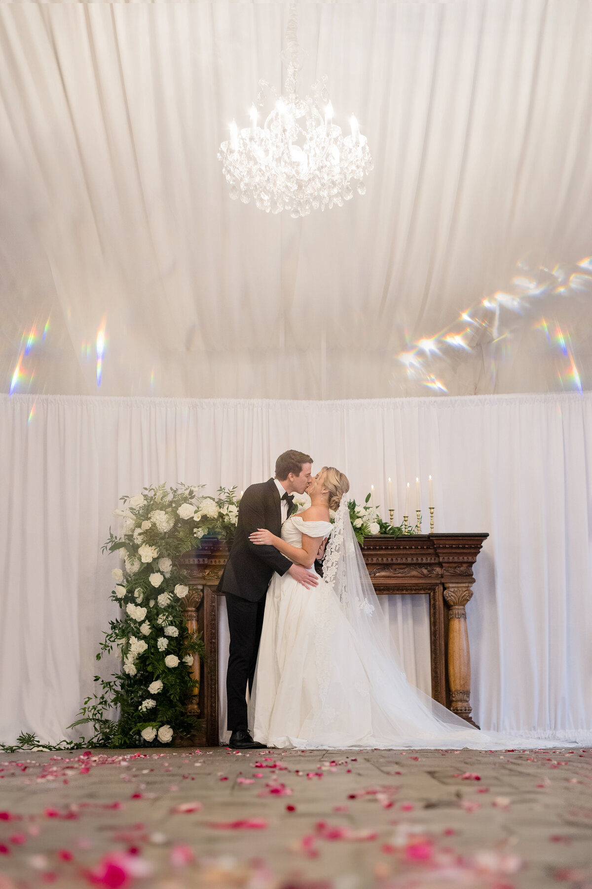 bride and groom with petal on floor