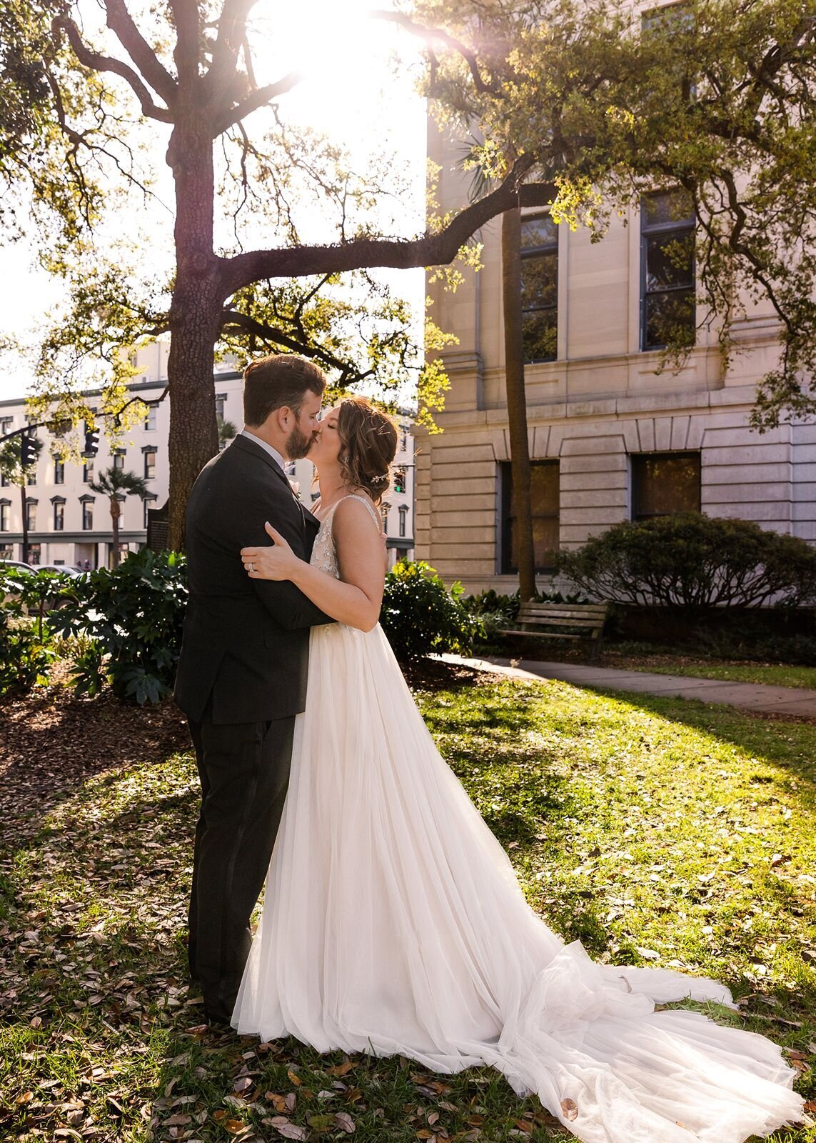 Bride and Groom kissing in park Savannah Georgia