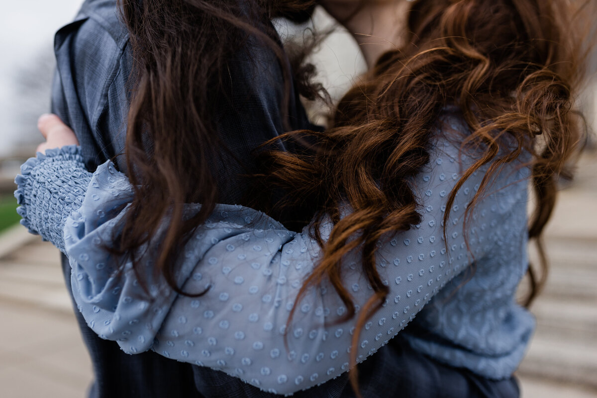 Detail of couples hair and blue outfits