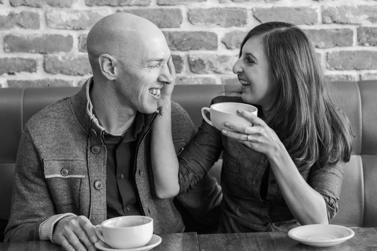 The couple takes a moment in a coffee shop in Newburyport MA
