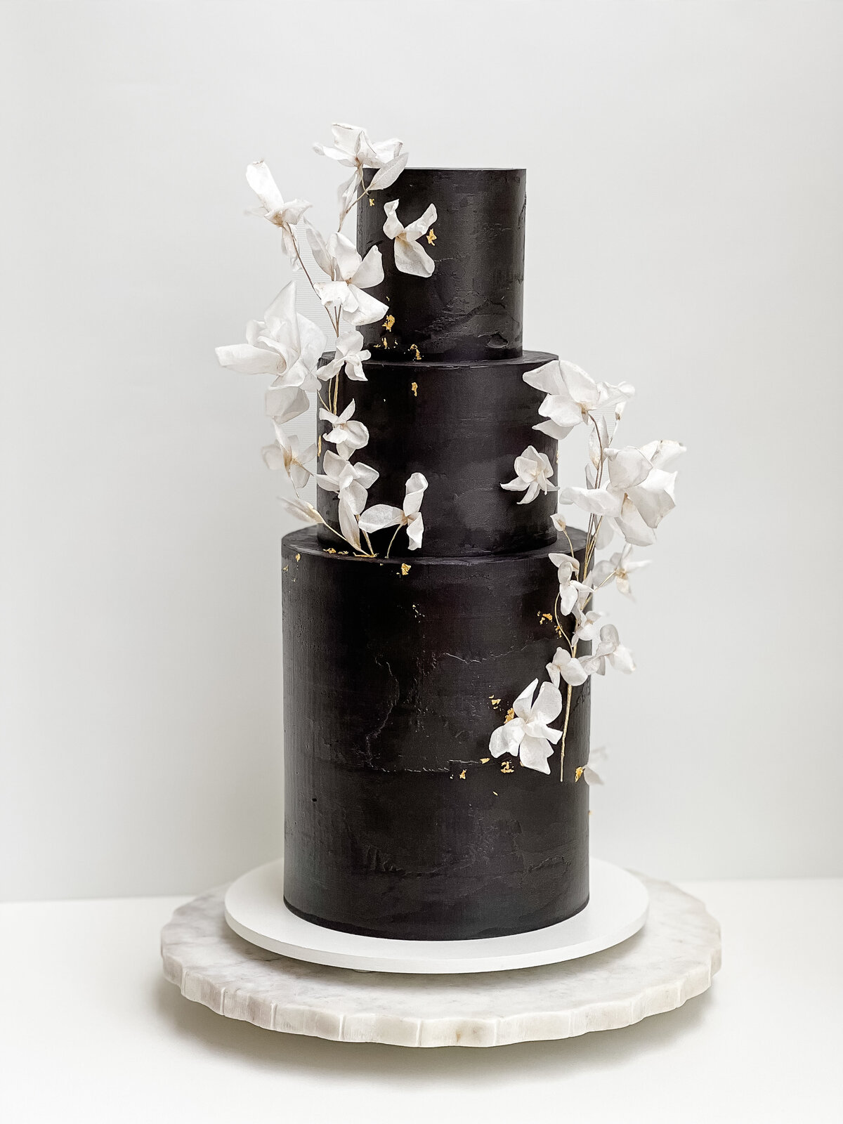 black buttercream  wafer paper flower wedding cake