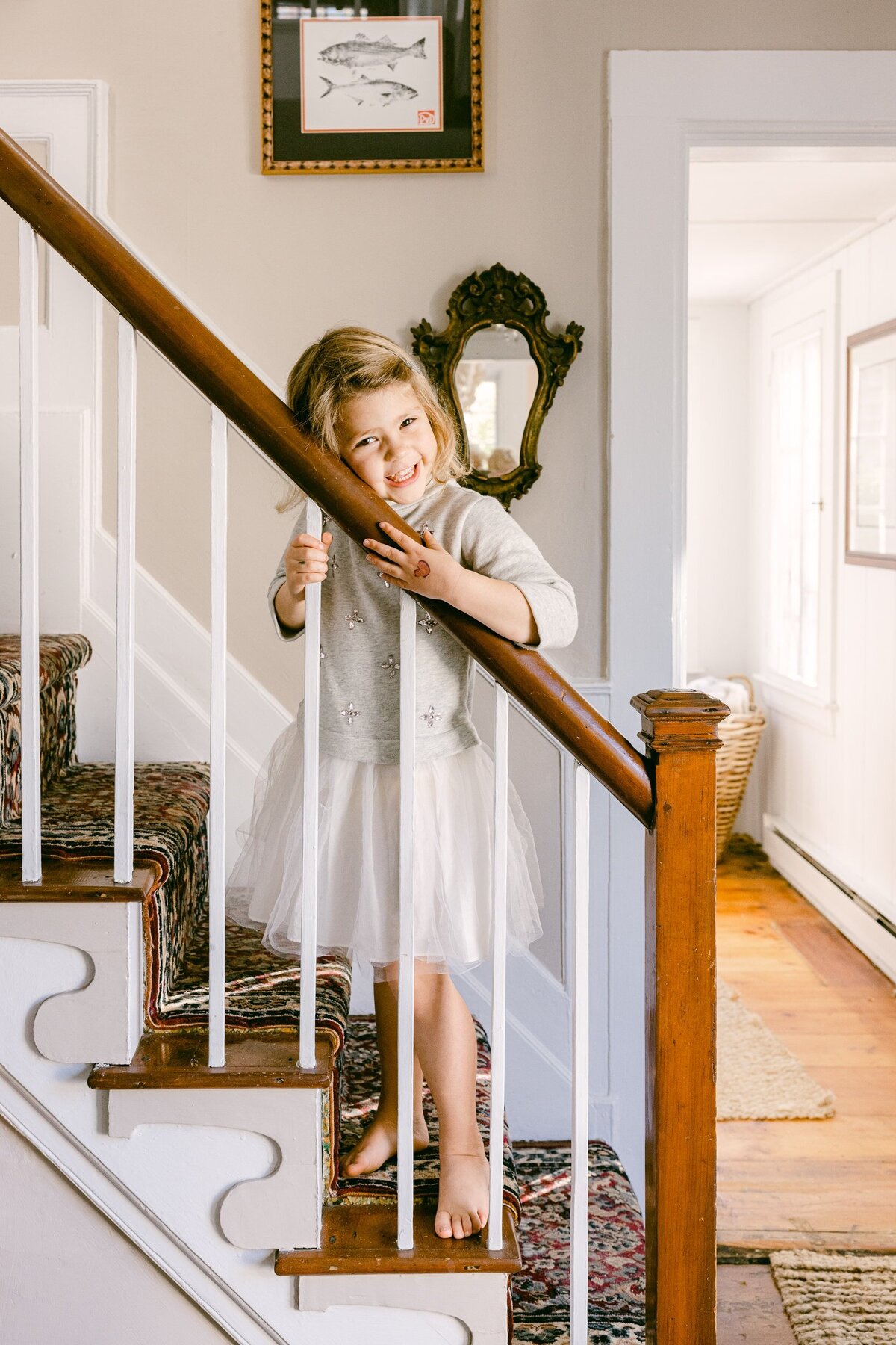 Girl in tutu on staircase
