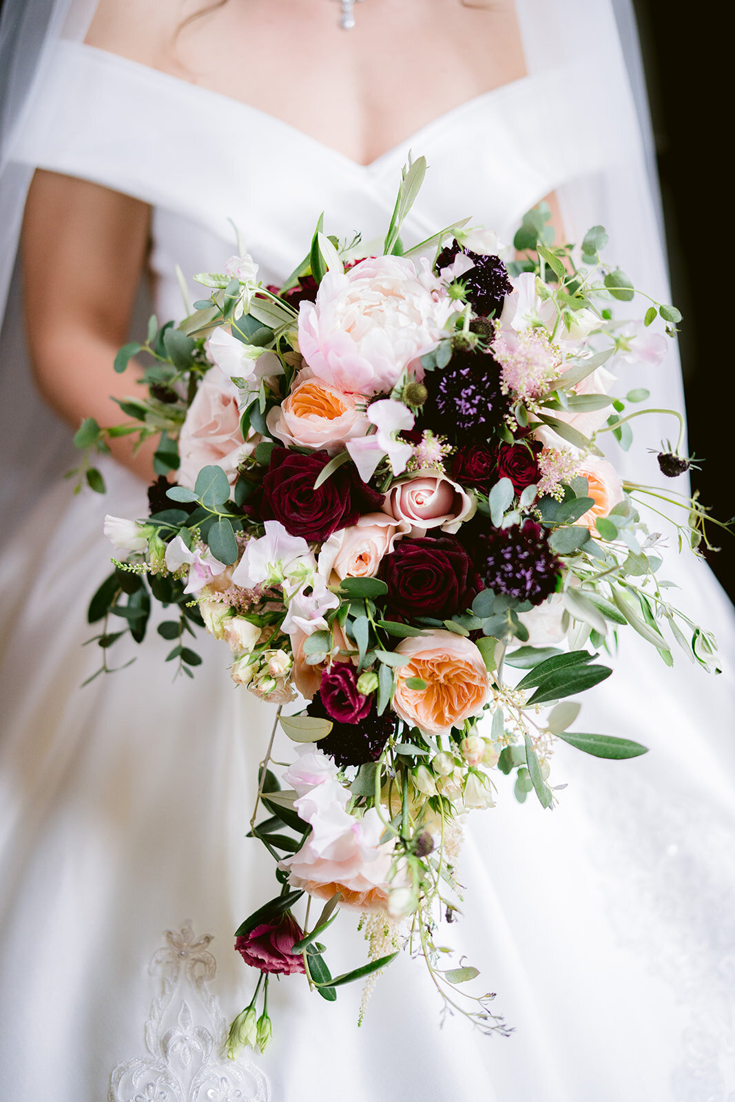 the brides bouquet at peckforton castle by red floral