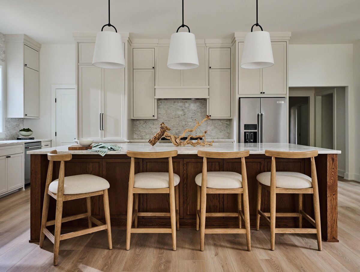 cocoloba homes graham ktichen with white island pendents and wooden barstools