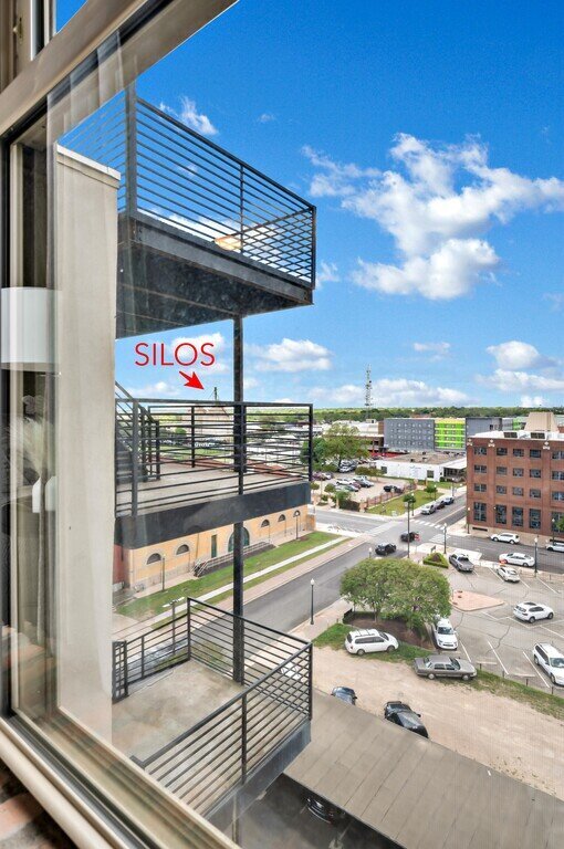 Beautiful view of downtown Waco and the Silos from the living room of this 2 bedroom, 2.5 bathroom luxury vacation rental loft condo for 8 guests with incredible downtown views, free parking, free wifi and professional decor in downtown Waco, TX.