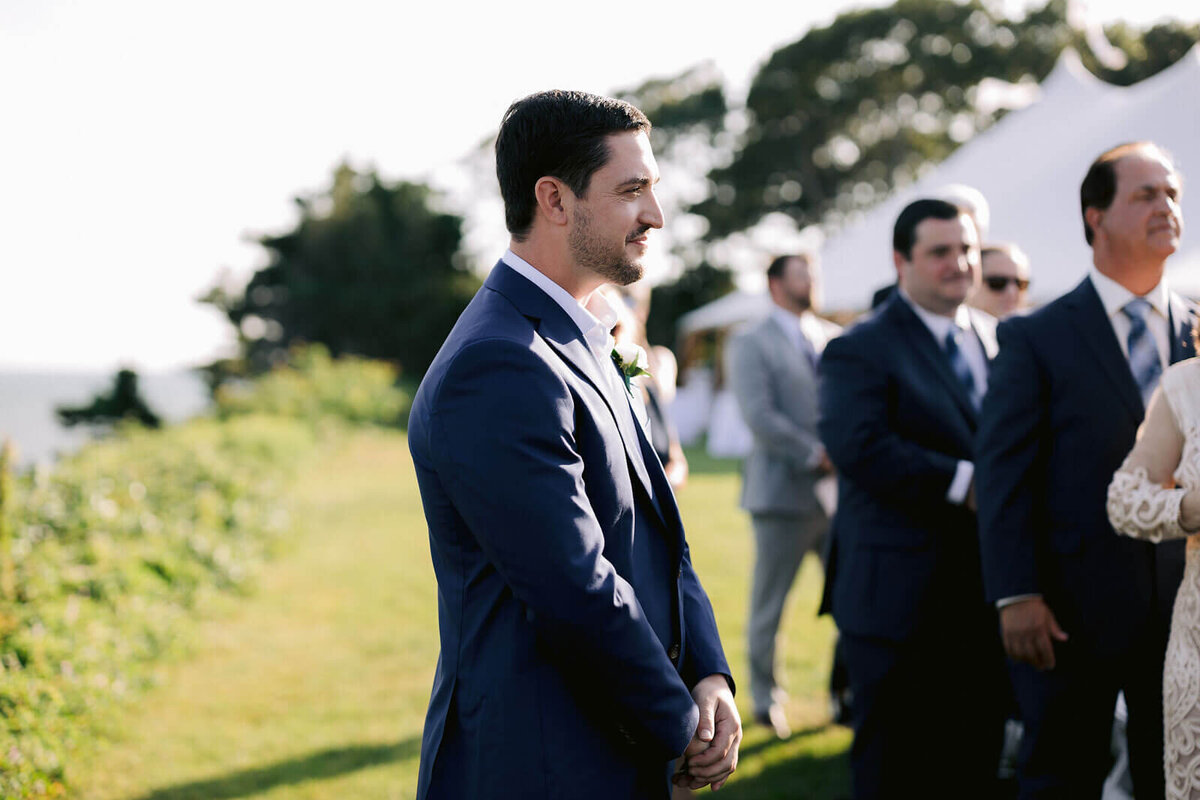 Side view of the groom in an outdoor wedding venue at Wianno, Cape Cod, MA.