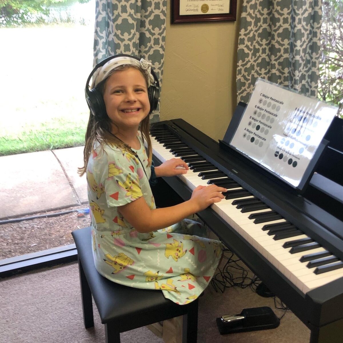 Little Girl learning to play piano in edmond oklahoma