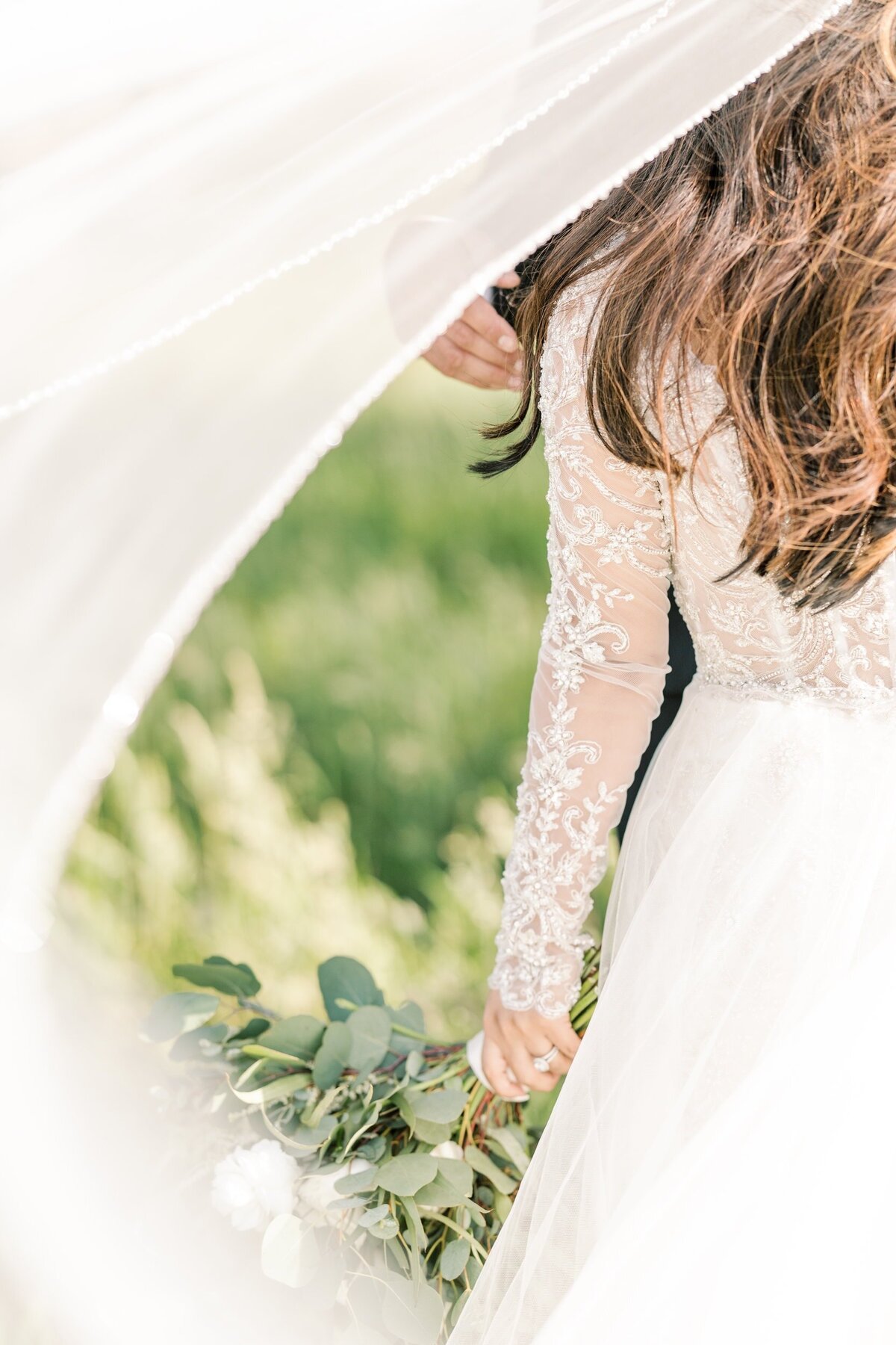 Close up of bride's dress and veil