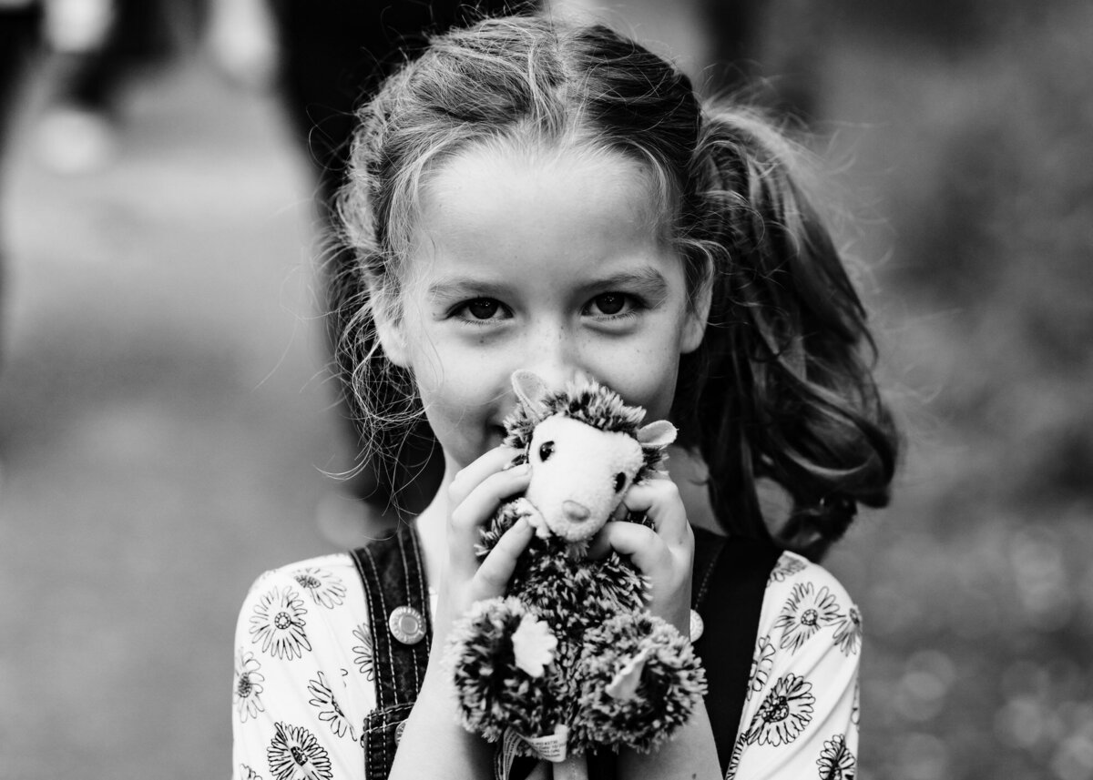 Black and whit eimage of girl and her teddy