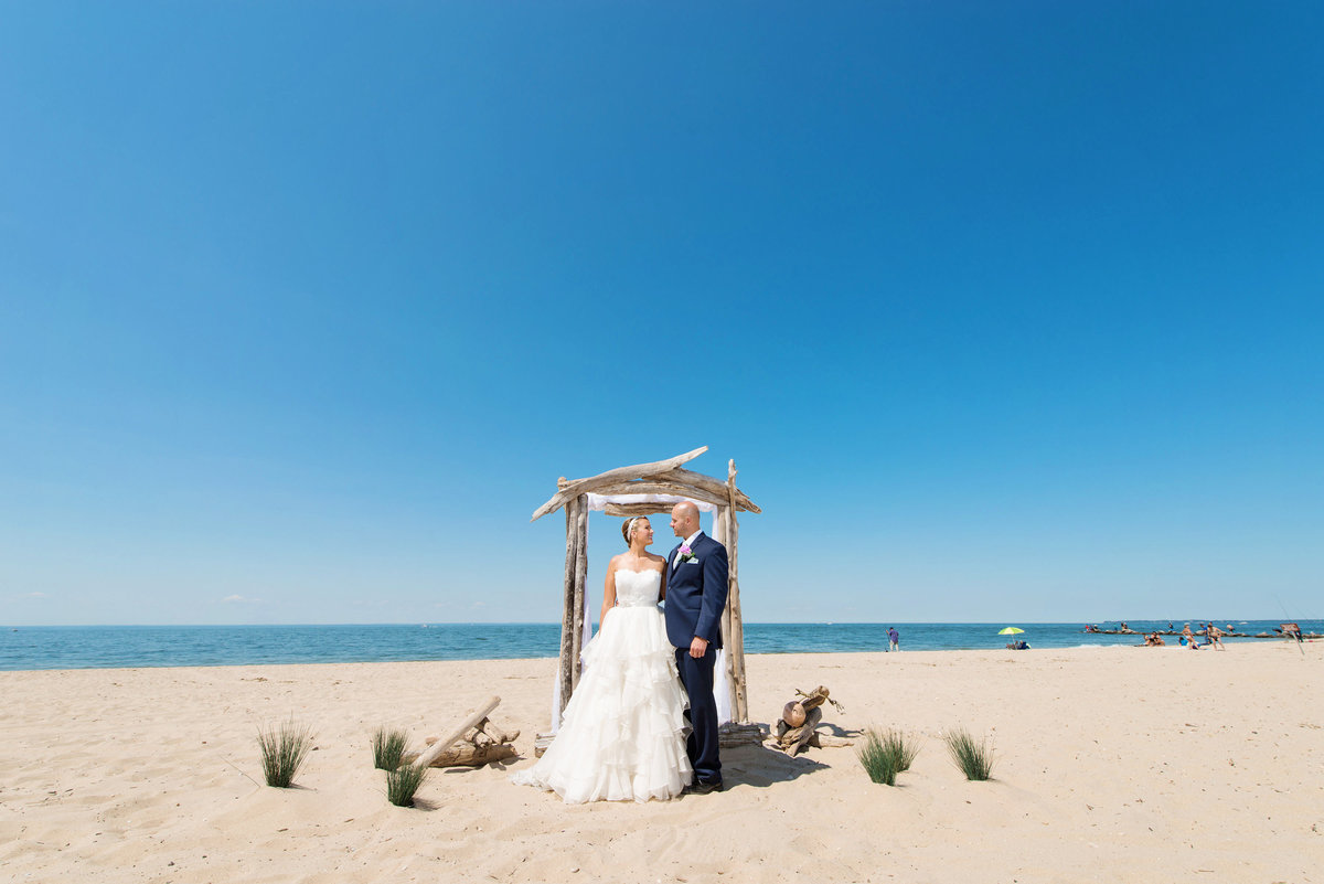 photo of bride a nd groom on the beach frm wedding at Pavilion at Sunken Meadow