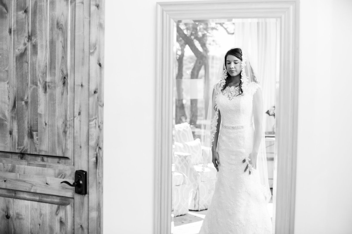canyonwood ridge wedding photographer bride looks in mirror 250 S Canyonwood Dr, Dripping Springs, TX 78620