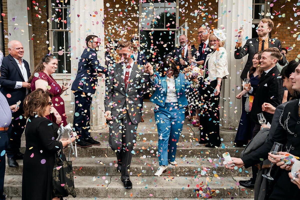 Newlyweds being showered with confetti