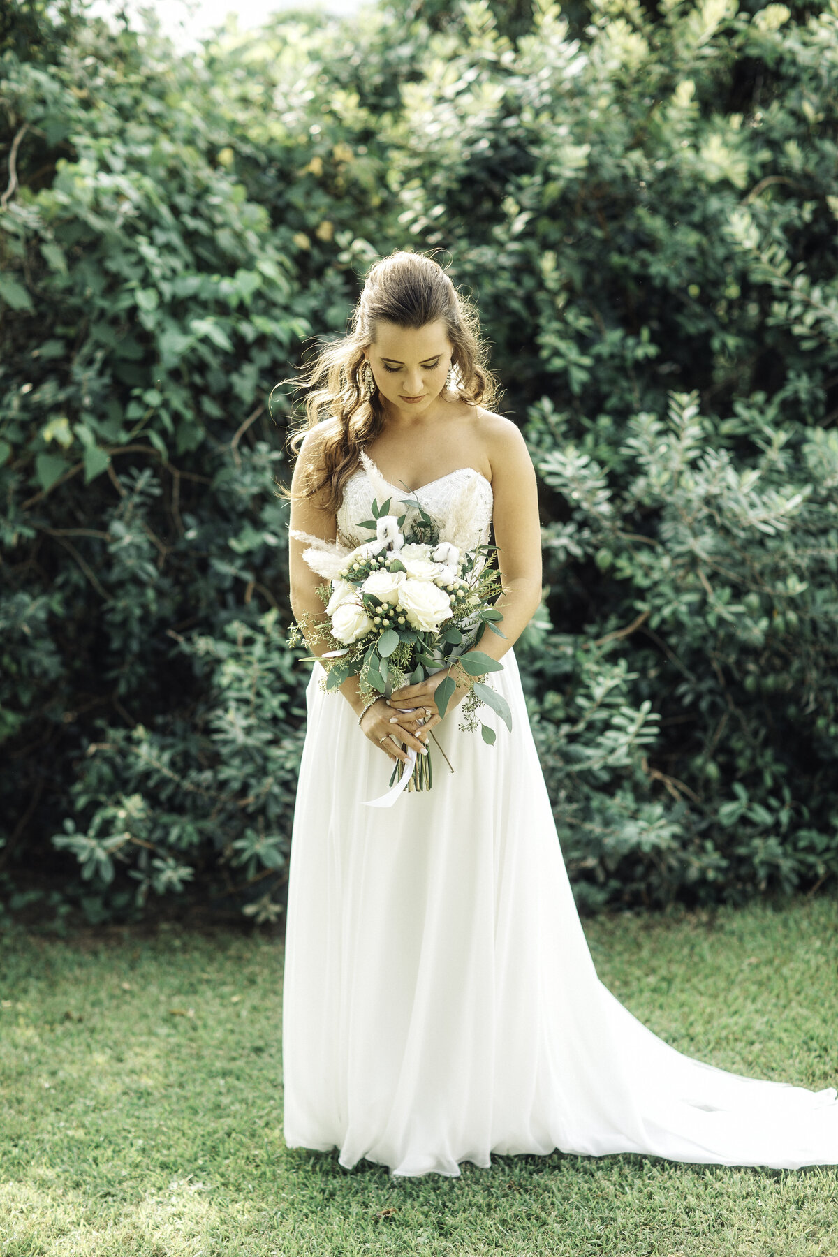 Wedding Photograph Of Bride Standing in Her White Dress Holding a Bouquet Of Flowers  Los Angeles