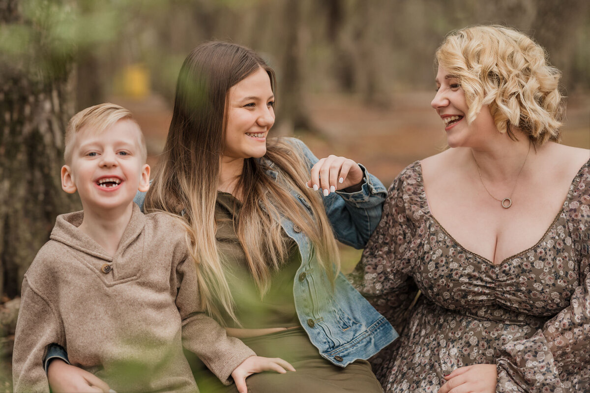 Mom and her two kids laughing with each other, lifestyle family photography by San Antonio photographer Cassey Golden.