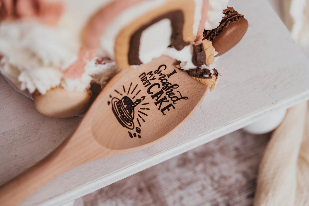 wooden spoon with a board and cake