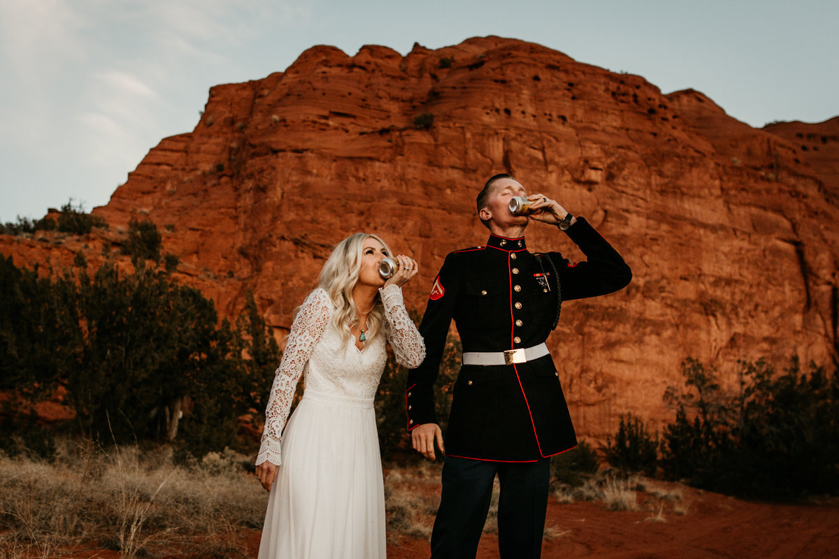 bride and groom shot gunning the desert