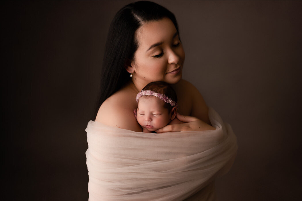 Brighton Newborn Photographer mom wrapped with baby by For The Love Of Photography