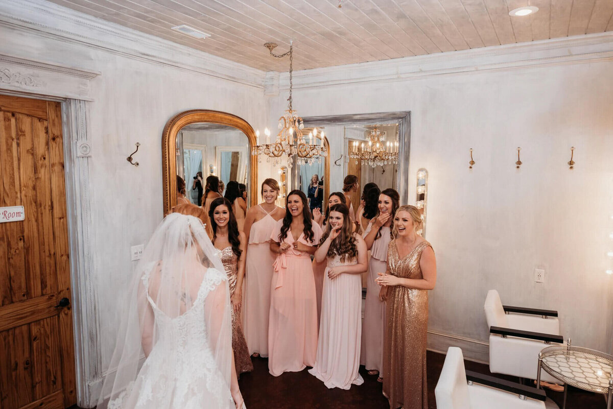 Photo of bridesmaids and pink dresses :-) want to see the bride for the first time inside of a white bridal suite