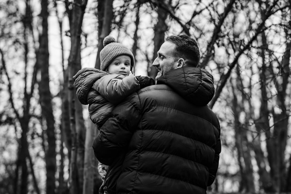 dad holding his son during winter family photoshoot