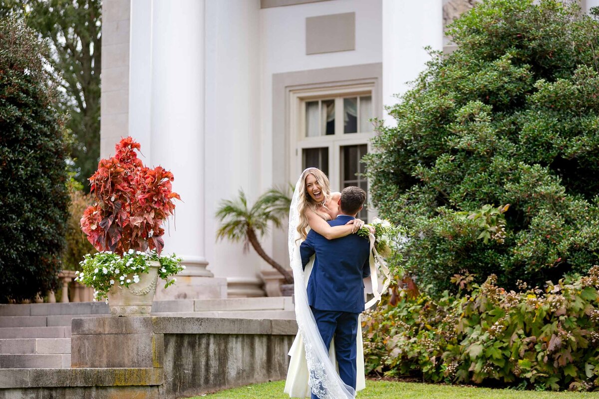 Candid moment of bride and groom at Hills & Dales in LaGrange wedding venue