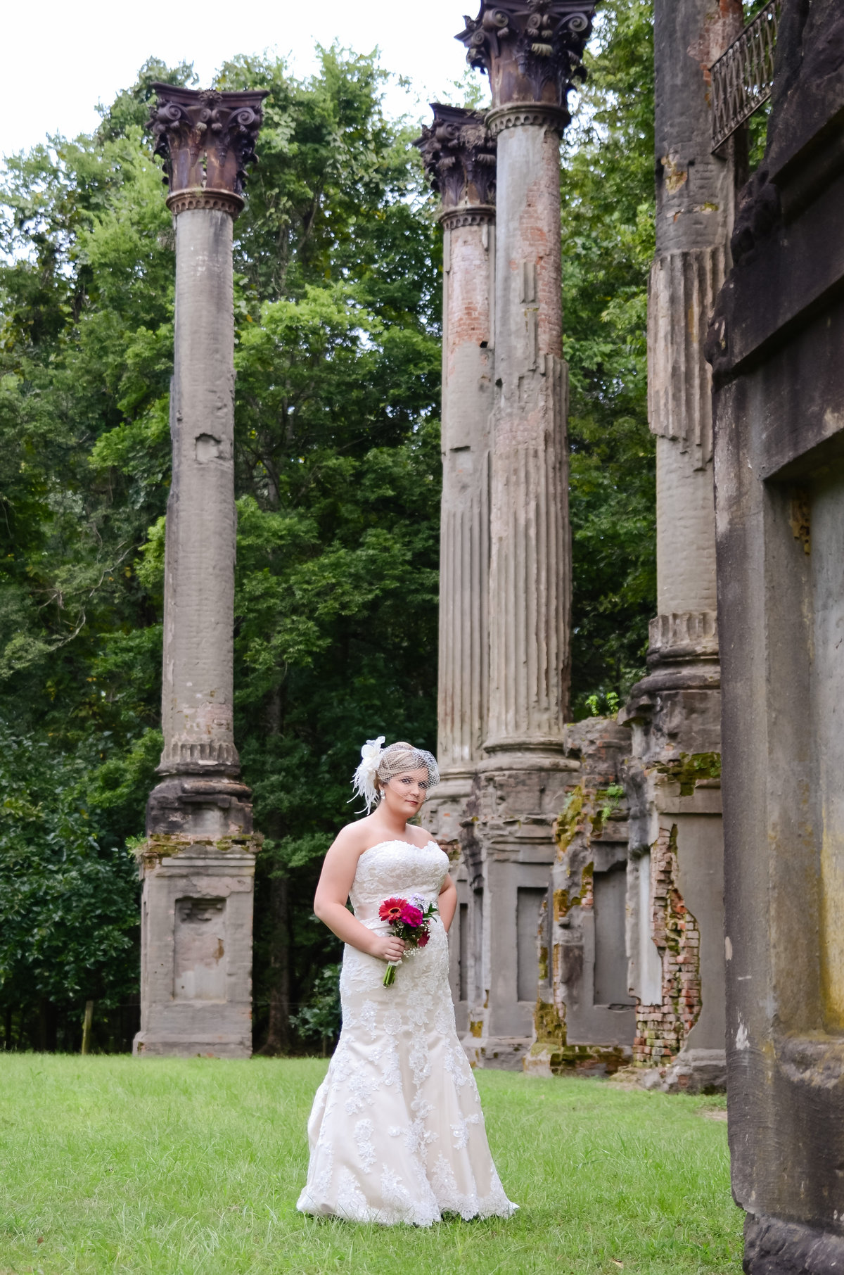 Beautiful bridal portrait photography: Bride with bouquet among the ruins of Windsor plantation in Port Gibson Mississippi