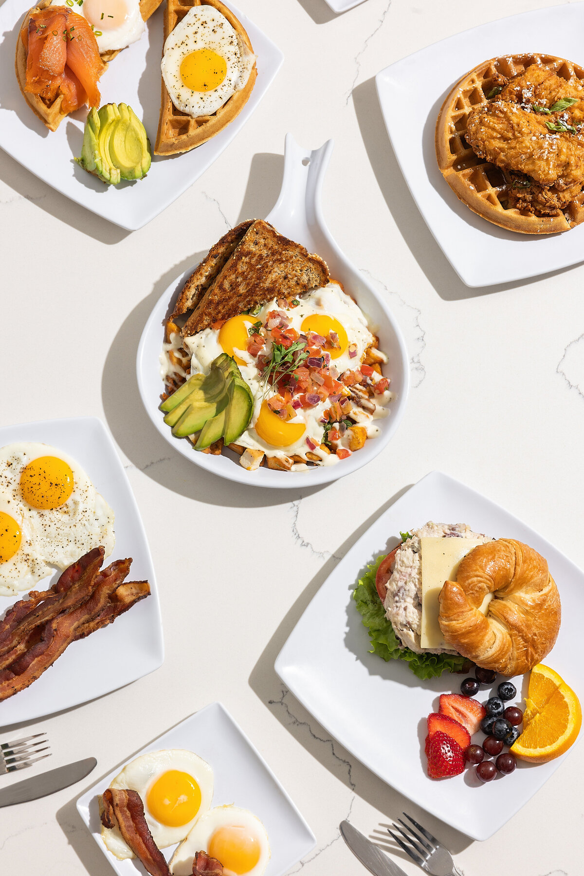 Various breakfast foods on plates