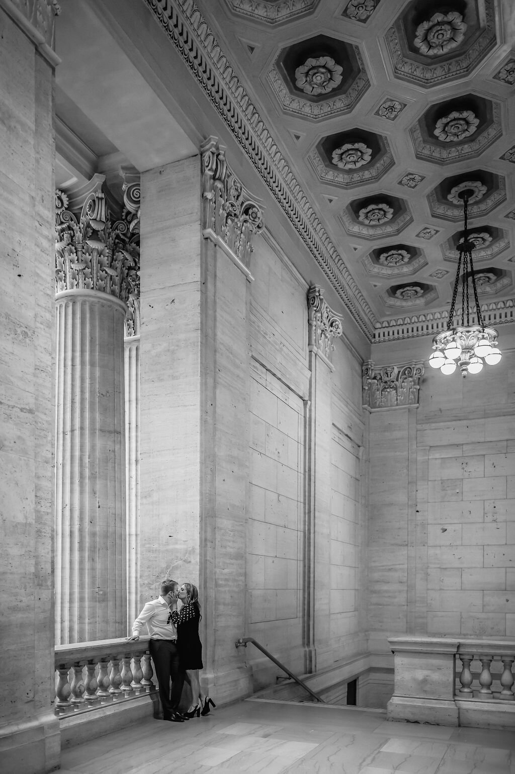 A couple kiss at the Chicago Union Station