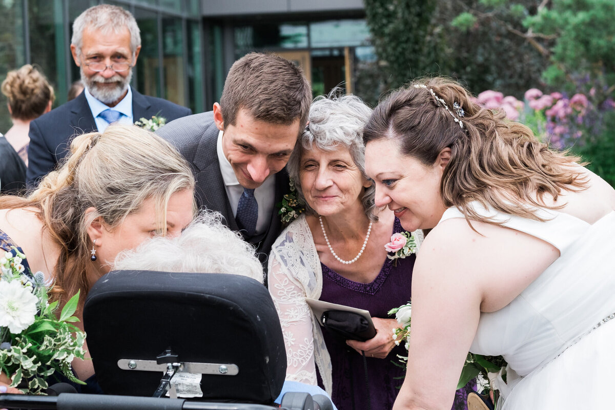 Bride-greeting-mother-in-wheelchair-scaled