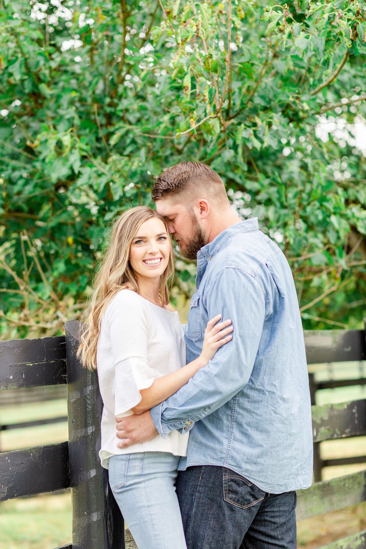 Happy-couple-in-love-holding-hands-posing-for-engagement-photos-in-Midwest-4