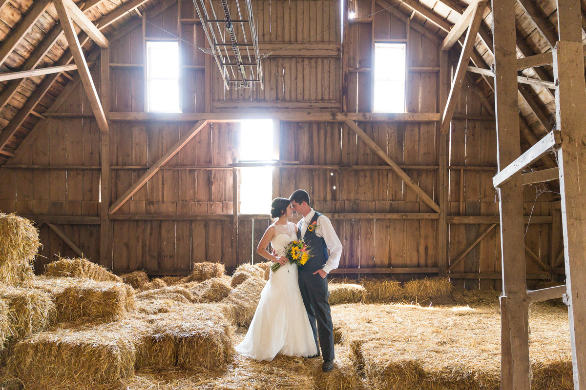 Barn photographs of a wedding day for a couple dairy farmer kids on their wedding day