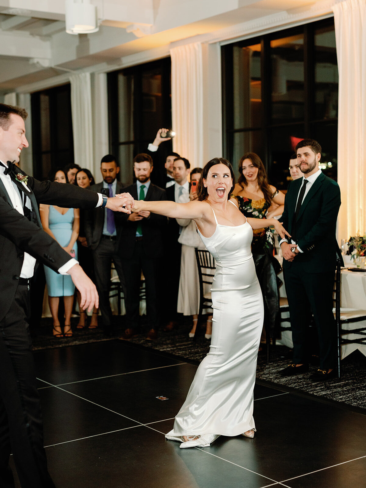 film image of bride and groom dancing