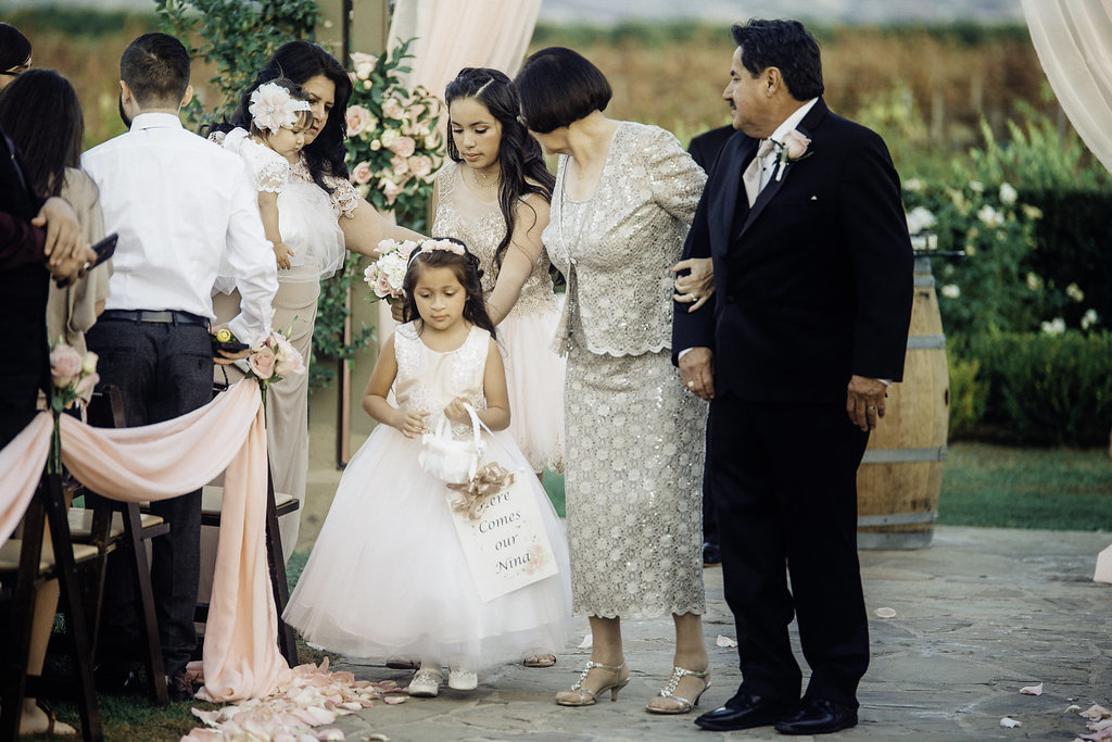 Wedding Photograph Of Visitors Looking At The Flower Girl Los Angeles