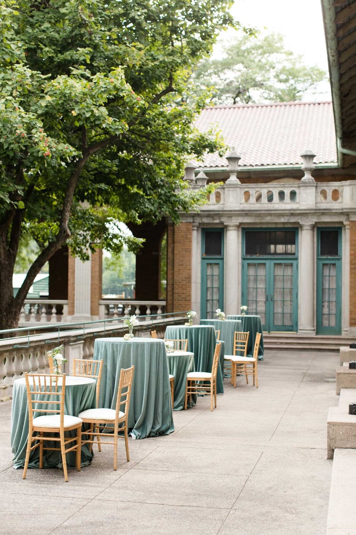 Outdoor Cocktail hour on the Terrace at Columbus Park Refectory for a Luxury Chicago Outdoor Historic Wedding Venue.