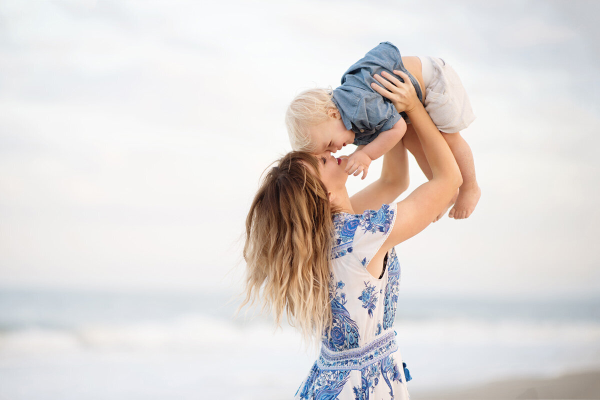 Family session of little boy and his mother in a dress