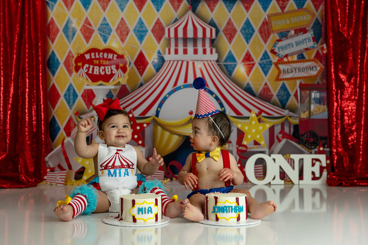 Twin toddlers celebrate their first birthday with a circus themed cake smash for their first birthday with a New Jersey Cake Smash Photographer
