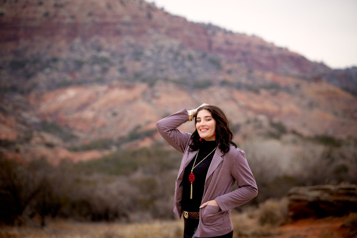 Senior girl standing in  Palo Duro Canyon State Park Tx